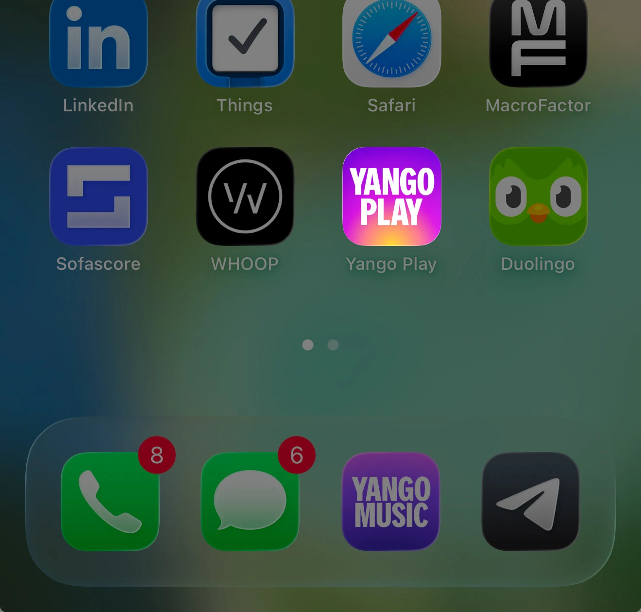 Yango Play app icon sitting on an iPhone home screen — a magenta-to-amber gradient tile with the wordmark inside.